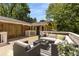 Spacious outdoor deck featuring comfortable seating, stylish decor, and a tranquil wooded backdrop at 1901 Trophy Dr, Marietta, GA 30062