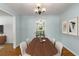 View from the dining room showing hardwood floors, adjacent kitchen, and living room at 1901 Trophy Dr, Marietta, GA 30062