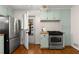 Kitchen with stainless steel appliances, wood floors and door to the exterior at 1901 Trophy Dr, Marietta, GA 30062