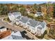 Aerial view of a neighborhood featuring townhomes, showcasing the layout, landscaping, and community setting at 2035 Parkside Ln, Roswell, GA 30076