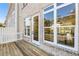 Inviting back deck with brick exterior and large windows to bring the outside in at 2035 Parkside Ln, Roswell, GA 30076