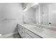 Modern bathroom featuring dual sinks, a large mirror, and sleek white cabinetry at 2035 Parkside Ln, Roswell, GA 30076
