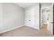 This bedroom features a double door closet, and is painted in a neutral color at 2035 Parkside Ln, Roswell, GA 30076