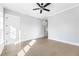 A modern bedroom features light hardwood floors and an open doorway with modern paint at 2035 Parkside Ln, Roswell, GA 30076