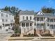 Charming townhome with brick facade, covered front porch, and well-maintained landscaping in a desirable neighborhood at 2035 Parkside Ln, Roswell, GA 30076