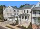 Beautiful brick townhome with covered porch and manicured landscaping showcasing its inviting curb appeal at 2035 Parkside Ln, Roswell, GA 30076