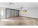 Spacious, unfinished garage with an automatic door and a large window at 2035 Parkside Ln, Roswell, GA 30076
