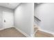 Clean hallway featuring hardwood floors, white trim, and a staircase leading to the upper level at 2035 Parkside Ln, Roswell, GA 30076