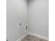 Functional laundry room with tile flooring, utility hookups, and space for appliances at 2035 Parkside Ln, Roswell, GA 30076