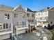 Rear exterior view of townhomes with garages, balconies and modern design at 2035 Parkside Ln, Roswell, GA 30076