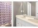 Double vanity bathroom includes mirrors and patterned shower curtain at 2123 Indian Ivey Ln, Dacula, GA 30019