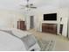 Bright bedroom with neutral decor, large windows, and a dark wood dresser at 2123 Indian Ivey Ln, Dacula, GA 30019