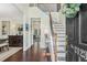 Elegant foyer with hardwood floors, staircase, and views into dining and living areas at 2123 Indian Ivey Ln, Dacula, GA 30019