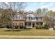 Traditional two-story brick home with a well-manicured lawn, covered porch, and inviting curb appeal at 2123 Indian Ivey Ln, Dacula, GA 30019