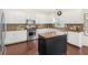 Bright kitchen features white cabinets, granite countertops, and stainless steel appliances at 2123 Indian Ivey Ln, Dacula, GA 30019