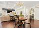 Open-concept living area with coffered ceilings connecting the living room, dining space, and kitchen at 2123 Indian Ivey Ln, Dacula, GA 30019