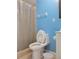 Bathroom featuring a toilet and shower with a clear curtain, combining functionality with essential fixtures at 6071 Deerfield Ct, Morrow, GA 30260