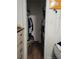 Narrow closet with shelving providing storage space at 6071 Deerfield Ct, Morrow, GA 30260