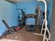 Inviting exercise room with multiple machines, weights and punching bag for a complete fitness setup at 6071 Deerfield Ct, Morrow, GA 30260