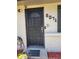 Close-up of the front door featuring a security gate and prominent house number at 6071 Deerfield Ct, Morrow, GA 30260