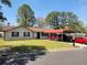Charming single-story home with well-maintained lawn and convenient covered parking at 6071 Deerfield Ct, Morrow, GA 30260