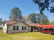 Inviting single-story home with brick accents, tidy landscaping and covered parking at 6071 Deerfield Ct, Morrow, GA 30260