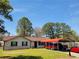 Charming single-story home with a carport and a well-manicured lawn, creating a welcoming curb appeal at 6071 Deerfield Ct, Morrow, GA 30260