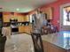 Spacious kitchen with stainless steel appliances, wood cabinets and view of dining area at 6071 Deerfield Ct, Morrow, GA 30260