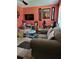 Comfortable living room featuring neutral colored carpet and soft, natural light at 6071 Deerfield Ct, Morrow, GA 30260