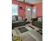 Cozy living room with neutral carpet and two comfortable green sofas at 6071 Deerfield Ct, Morrow, GA 30260