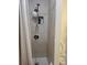 Updated shower stall featuring modern fixtures and built-in storage at 6071 Deerfield Ct, Morrow, GA 30260