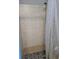 Tiled shower with contrasting floor, offers a clean and functional space for daily routines at 6071 Deerfield Ct, Morrow, GA 30260