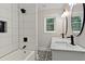 Bathroom featuring double vanity, modern fixtures, decorative tile, and tiled shower at 3918 Artist Vw, Decatur, GA 30034