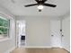 Bedroom featuring light hardwood floors, ceiling fan, ensuite bathroom, and closet at 3918 Artist Vw, Decatur, GA 30034