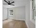 Bedroom with light hardwood floors, a ceiling fan, and bright natural light at 3918 Artist Vw, Decatur, GA 30034