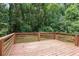 Inviting wooden deck surrounded by lush greenery and mature trees at 3918 Artist Vw, Decatur, GA 30034