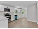 Modern kitchen featuring stainless steel appliances, white cabinets, and a bold blue dishwasher at 3918 Artist Vw, Decatur, GA 30034