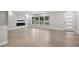 Spacious living room with a modern fireplace and stylish wood-look flooring at 3918 Artist Vw, Decatur, GA 30034