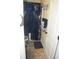 Bathroom featuring a decorative navy blue shower curtain, contrasting against the light walls and tile flooring at 504 Liverpool Dr, Mcdonough, GA 30252