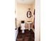 Cozy bathroom with a pedestal sink, neutral tones and dark tile flooring, designed for convenience at 504 Liverpool Dr, Mcdonough, GA 30252
