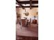 Charming dining room featuring a chandelier, a glass-top table, and neutral tones, creating an inviting ambiance at 504 Liverpool Dr, Mcdonough, GA 30252