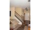 Neutral foyer showcases a staircase, front door, and adjacent living area at 504 Liverpool Dr, Mcdonough, GA 30252
