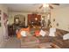 Warm living room with cozy sectional sofa, open to kitchen and dining area at 504 Liverpool Dr, Mcdonough, GA 30252