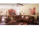Inviting living room featuring a cozy sectional sofa and an open layout to the kitchen and dining area at 504 Liverpool Dr, Mcdonough, GA 30252