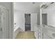 Bright bathroom features a built-in tub with shower, and a dual sink vanity at 2377 Proctor Creek Enclave, Acworth, GA 30101