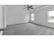 Spacious bedroom with neutral carpet, bright windows, and a ceiling fan at 2377 Proctor Creek Enclave, Acworth, GA 30101