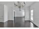 Spacious dining room with rich, dark hardwood floors and natural light at 2377 Proctor Creek Enclave, Acworth, GA 30101