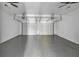 Spacious two car garage featuring white walls and ceiling fans, offering ample parking and storage at 2377 Proctor Creek Enclave, Acworth, GA 30101