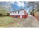 View of the house with a backyard, patio, and small amount of green lawn at 430 Argus Nw Cir, Atlanta, GA 30331