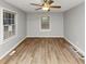 Bedroom with ceiling fan and natural light from the windows and wood-look floors at 430 Argus Nw Cir, Atlanta, GA 30331